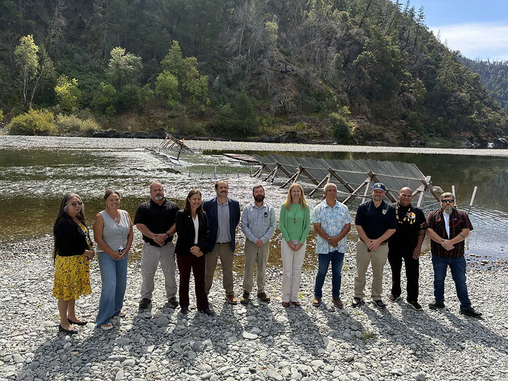 People standing next to river. CDFW photo